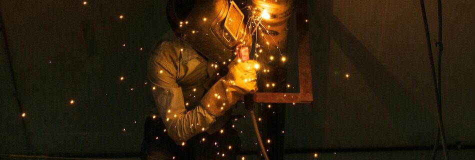 man welding